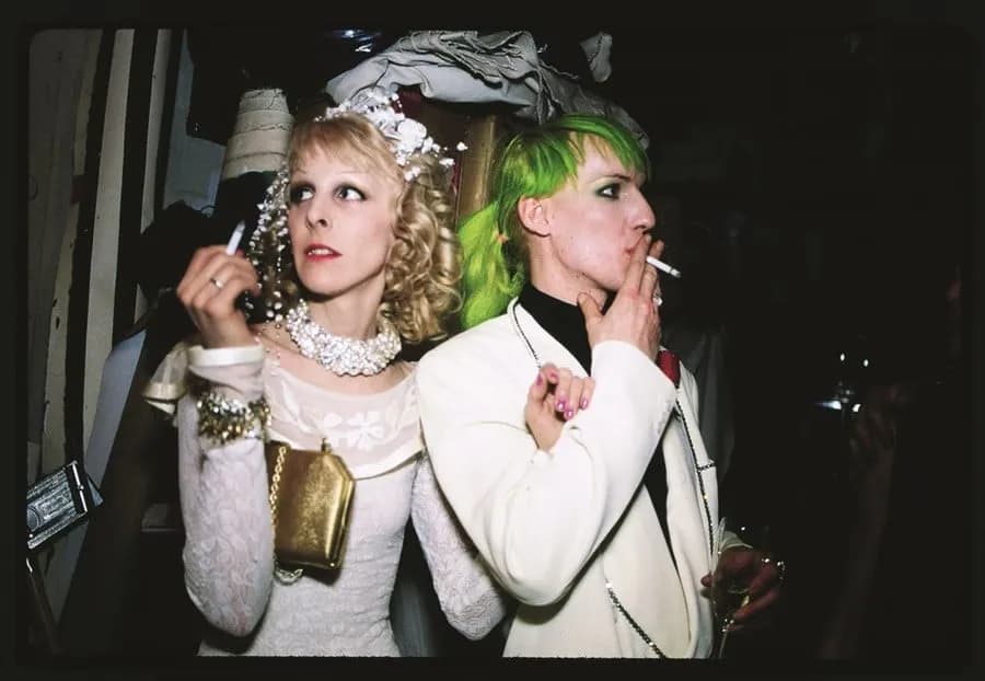 Greer Lankton, artist and dollmaker, posing alongside a companion in an intimate and creative setting