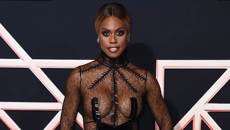 Laverne Cox, actress and transgender advocate, smiling in an elegant outfit